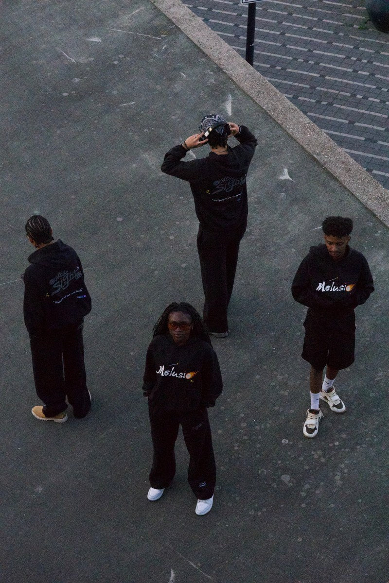 Four Famistas in Outta Sight, seen from above on a concrete square